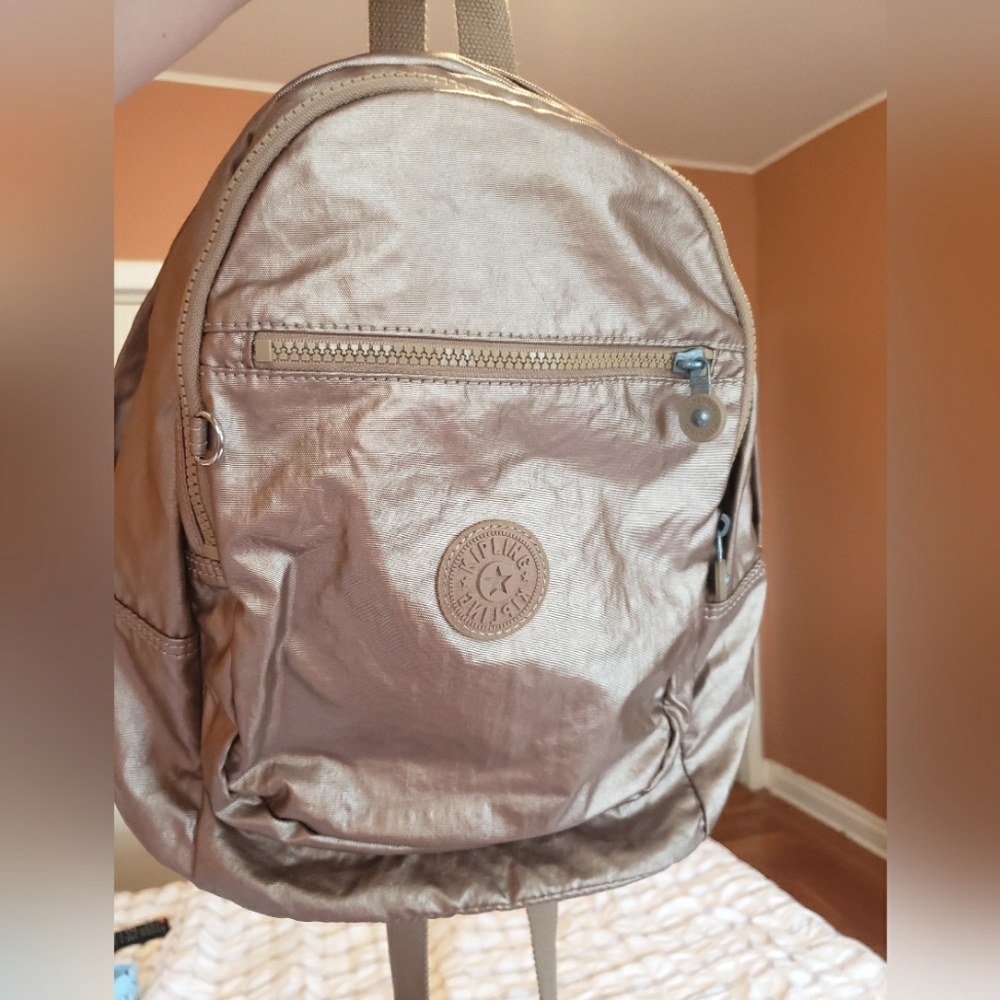 Kipling metallic small backpack excellent condition.